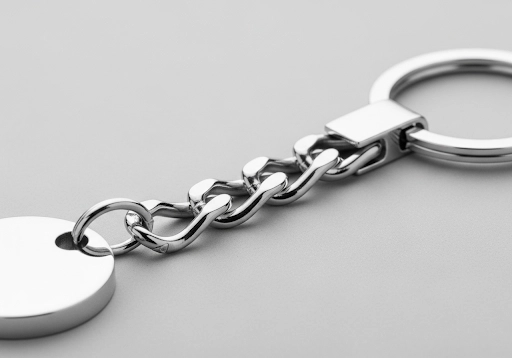 A keychain featuring a short metal connector chain for added flexibility.