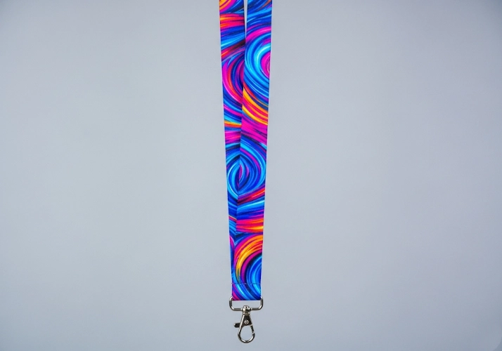 A vibrant, full-color printed polyester lanyard.