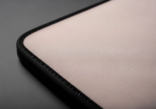 A close-up showing a soft, smooth nylon fabric layer on a neoprene product.