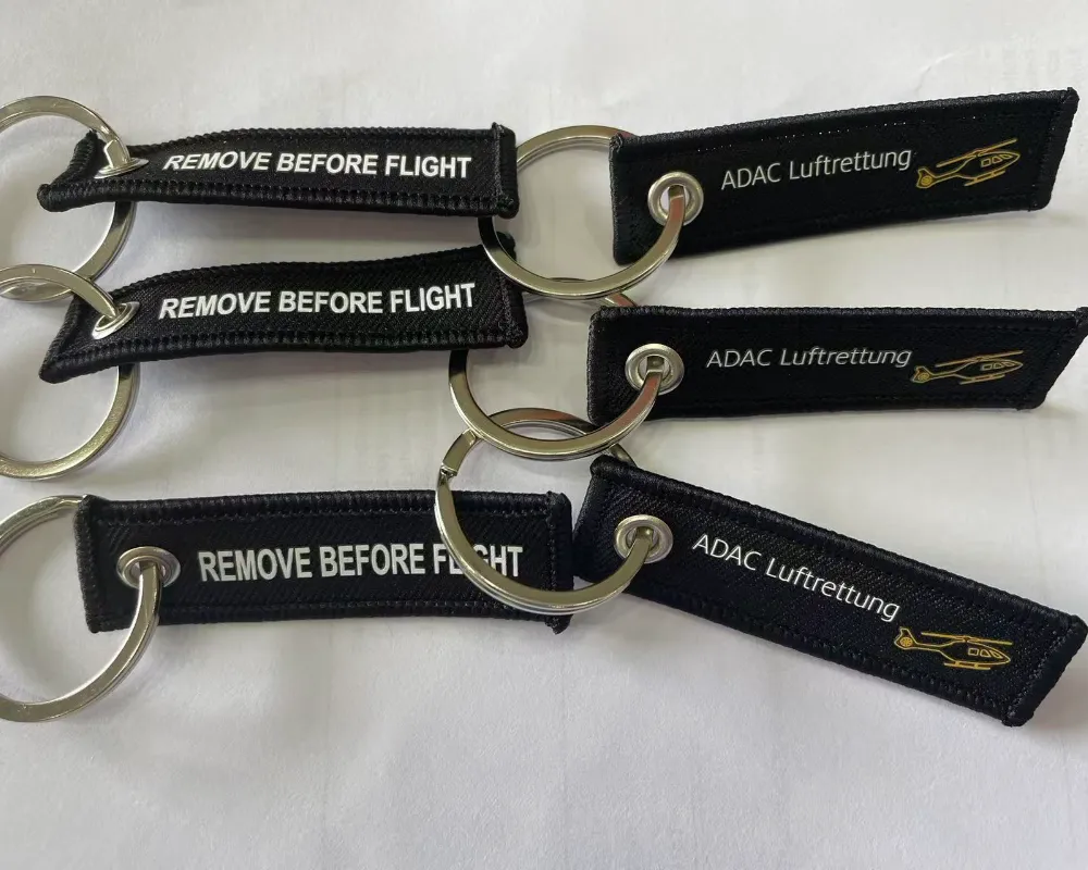 An ADAC Luftrettung fabric keychain with a vibrant, full-color photorealistic design.