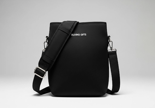A neoprene lunch bag with an adjustable shoulder strap for easy carrying.