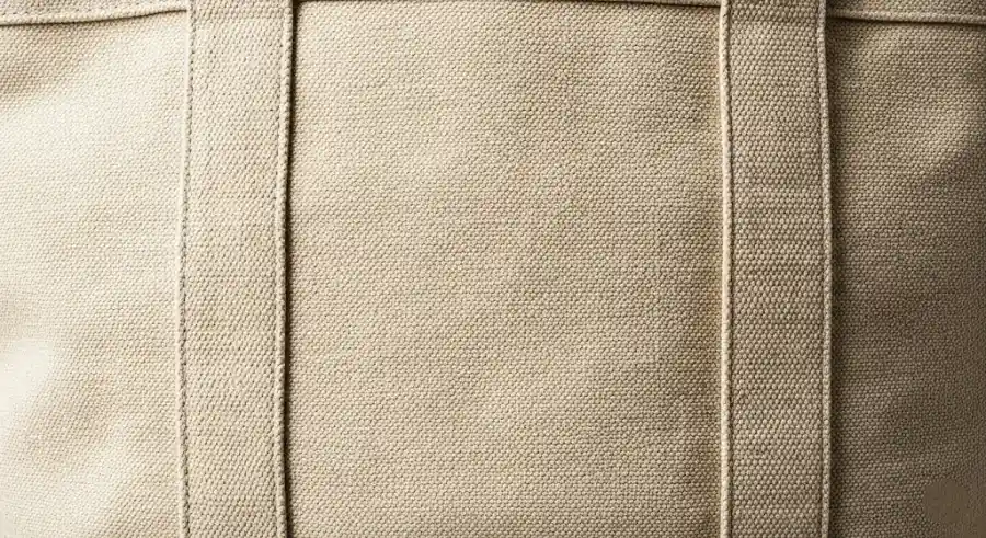 A sturdy, heavy-duty canvas tote bag showing its thick weave.