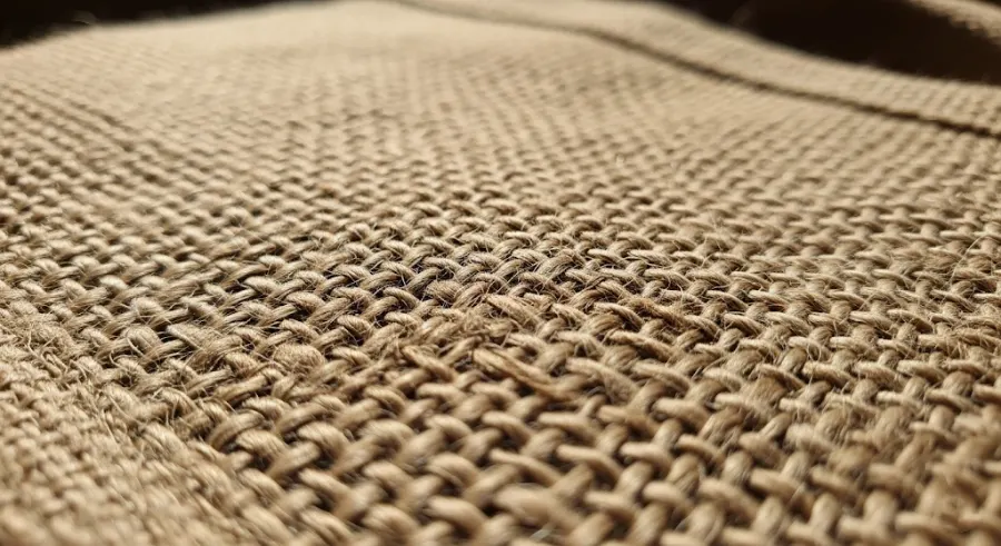 A close-up shot of the natural, rustic texture of a jute bag.