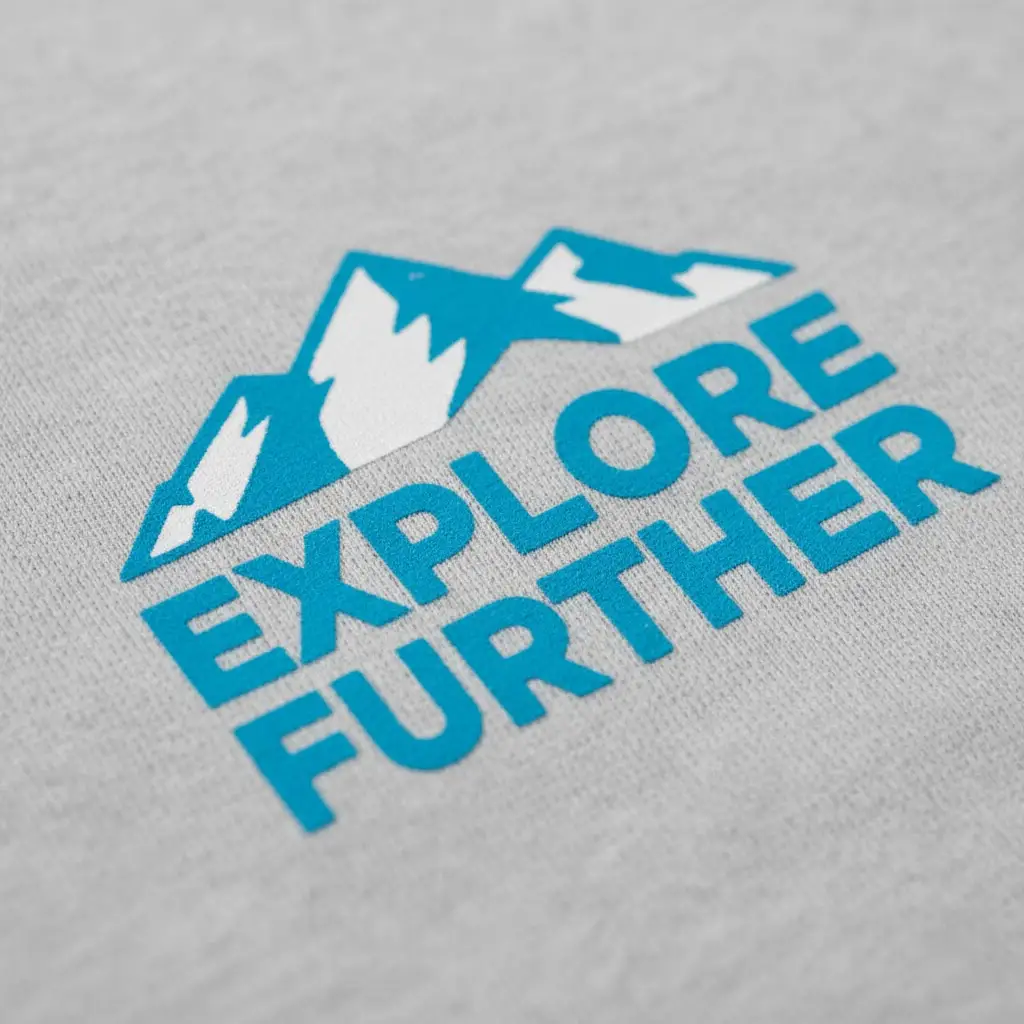 A detailed macro shot of a screen-printed logo on a cotton t-shirt, showing the crisp edges and solid layer of ink.