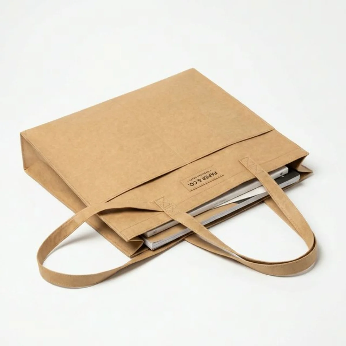 A flat washable kraft paper tote bag, ideal for documents and light retail.